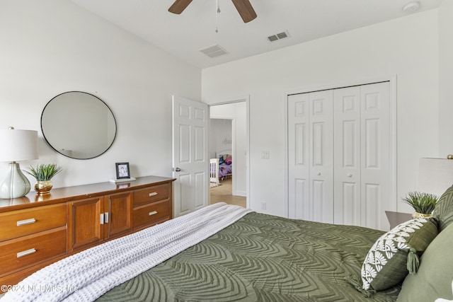 bedroom with a closet, visible vents, and a ceiling fan