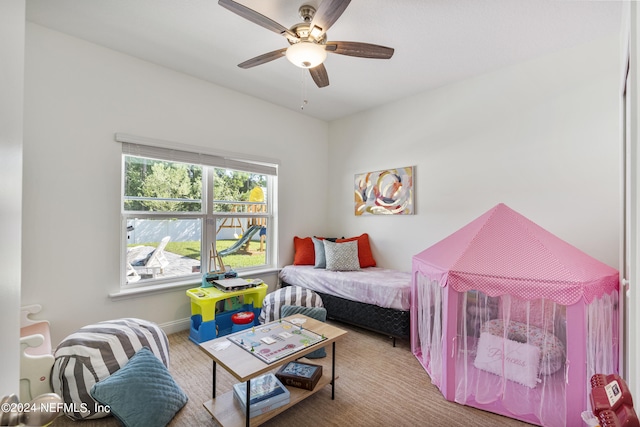 bedroom with ceiling fan, baseboards, and carpet flooring