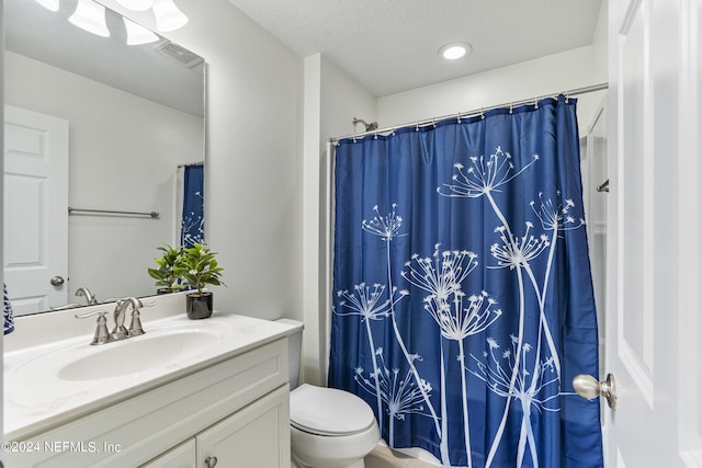 full bath featuring visible vents, toilet, curtained shower, a textured ceiling, and vanity