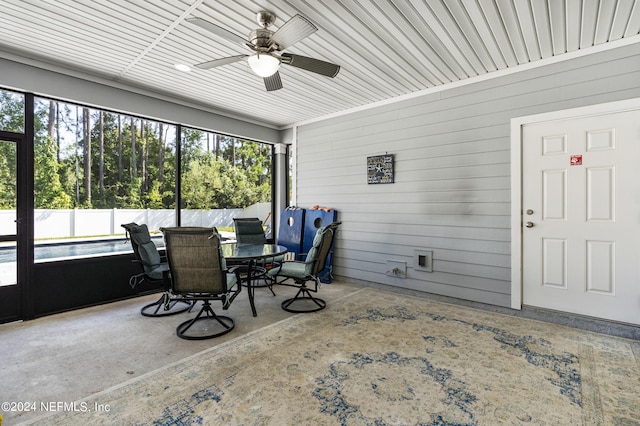 sunroom with a ceiling fan