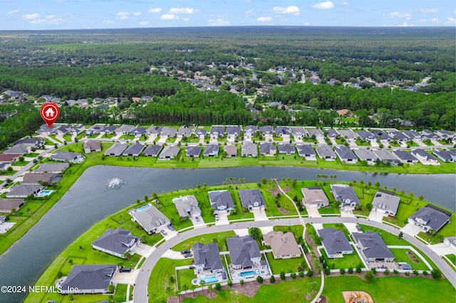 birds eye view of property with a residential view and a water view