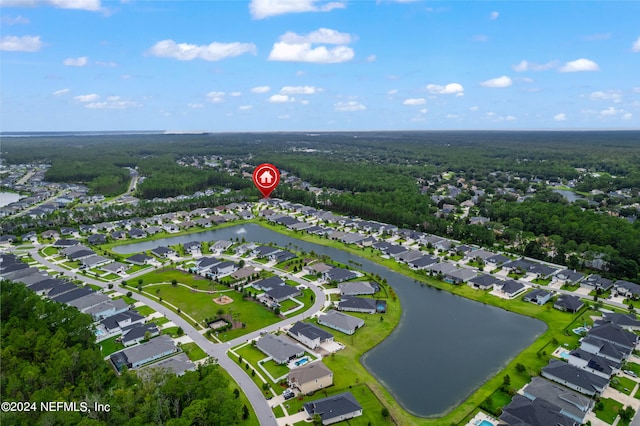 birds eye view of property with a water view and a residential view