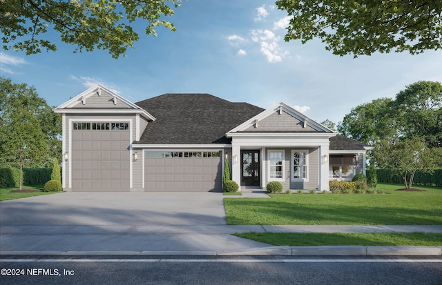 view of front facade with a front lawn and a garage