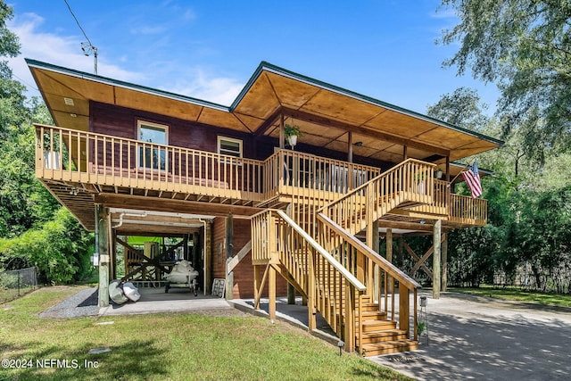 back of property with a patio area, stairs, fence, and a yard