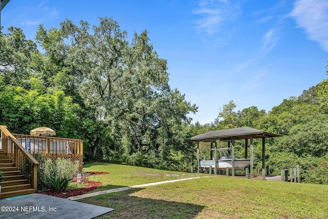 view of yard with stairway and a wooden deck