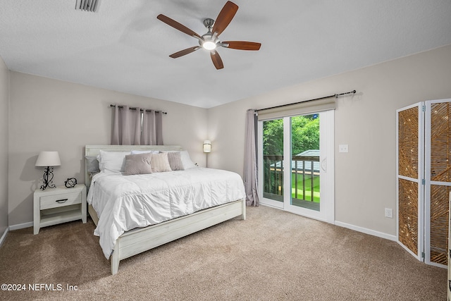 bedroom featuring carpet floors, ceiling fan, and access to exterior