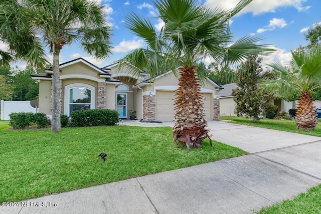 view of front facade featuring a front lawn and a garage