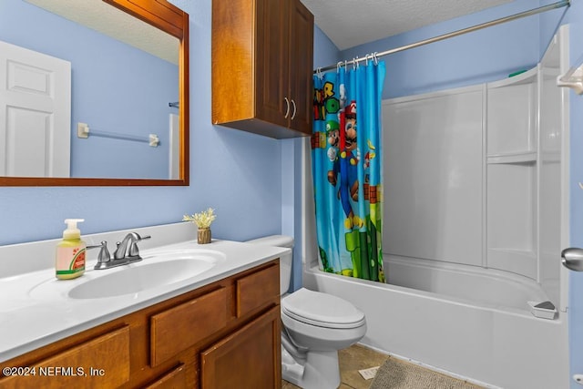 full bathroom with toilet, tile patterned flooring, shower / bath combo with shower curtain, vanity, and a textured ceiling