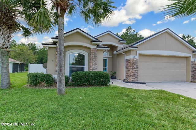 view of front of home featuring a garage and a front yard