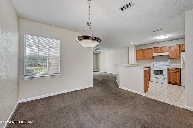 kitchen with ceiling fan, light carpet, hanging light fixtures, and white appliances