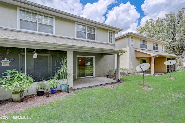 exterior space featuring a patio area and a front lawn