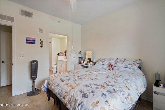 bedroom featuring tile patterned flooring and ensuite bathroom