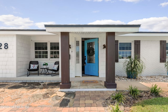 entrance to property with covered porch