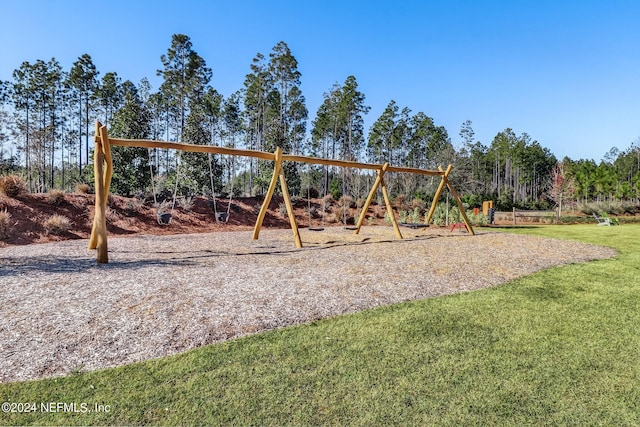 view of jungle gym featuring a yard