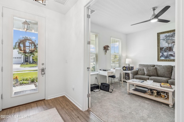 entryway with light wood-type flooring, a wealth of natural light, and ceiling fan