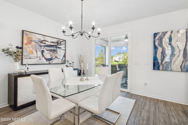 dining room with an inviting chandelier and light hardwood / wood-style floors