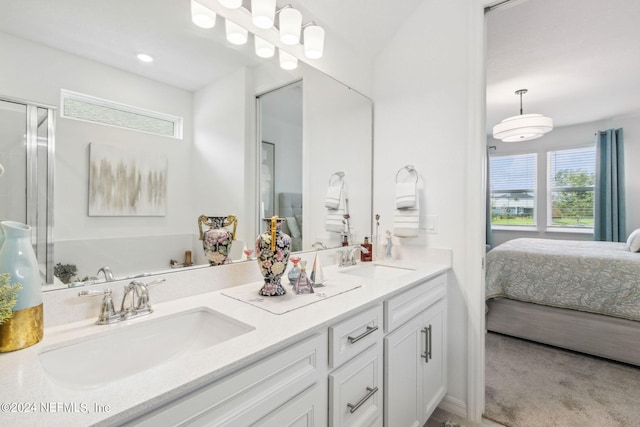 bathroom with vanity and a shower with shower door