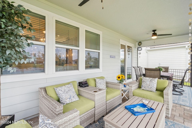 exterior space featuring ceiling fan and an outdoor hangout area