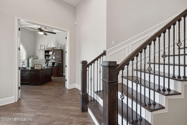 stairs with ceiling fan and hardwood / wood-style floors