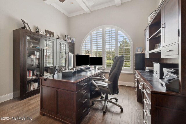 office with ceiling fan, hardwood / wood-style flooring, crown molding, and beamed ceiling