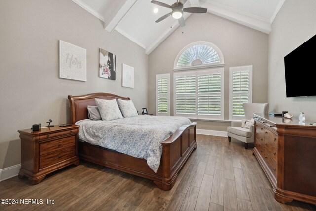 bedroom featuring ceiling fan, ornamental molding, dark hardwood / wood-style flooring, and lofted ceiling with beams