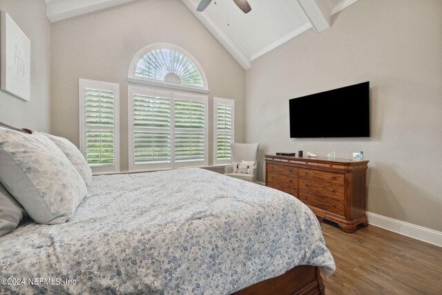 bedroom featuring high vaulted ceiling, hardwood / wood-style floors, ceiling fan, and beamed ceiling