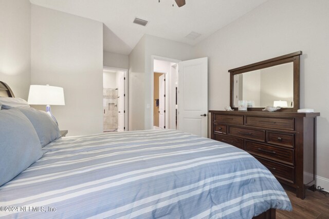 bedroom with ceiling fan, ensuite bathroom, and hardwood / wood-style flooring