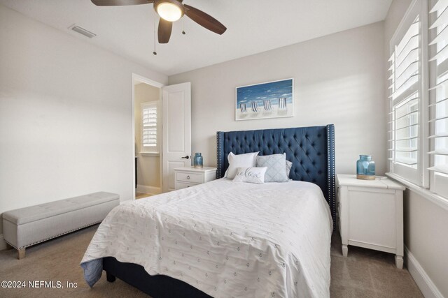 bedroom with ceiling fan and carpet floors