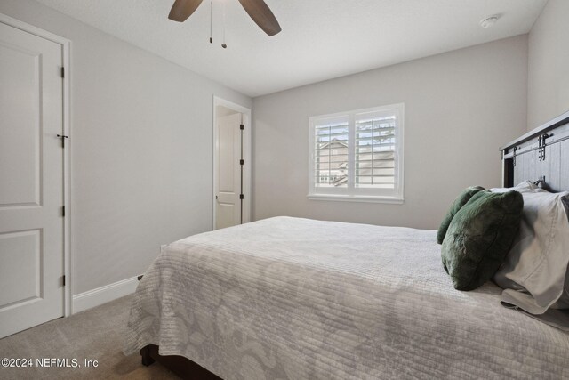 bedroom featuring carpet and ceiling fan