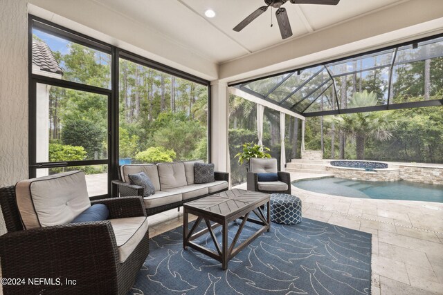 sunroom / solarium featuring ceiling fan