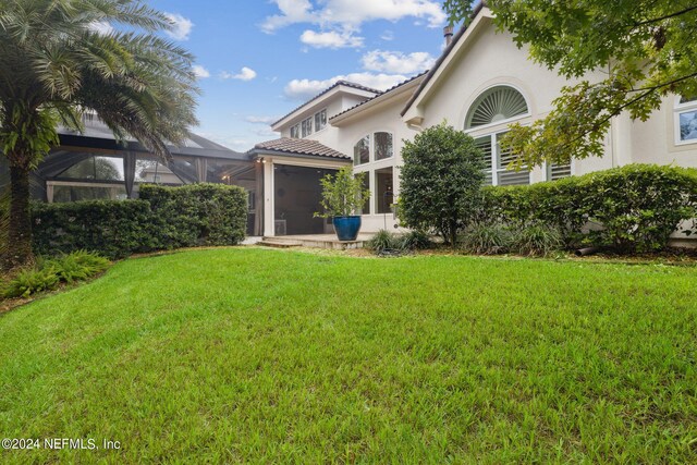 view of yard with a sunroom