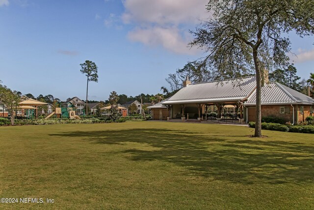 view of property's community with a lawn