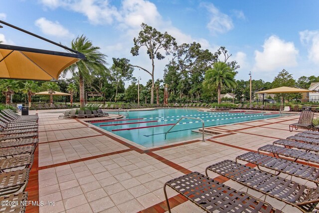 view of swimming pool featuring a patio area