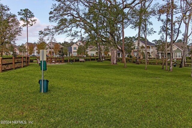 view of property's community with a yard