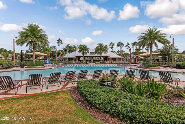 view of swimming pool with a patio