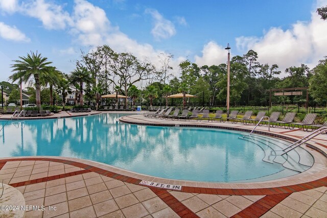 view of swimming pool with a patio area