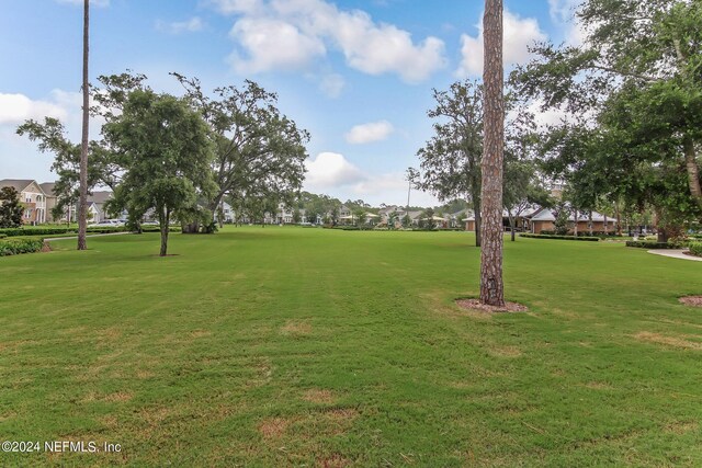 view of community featuring a yard