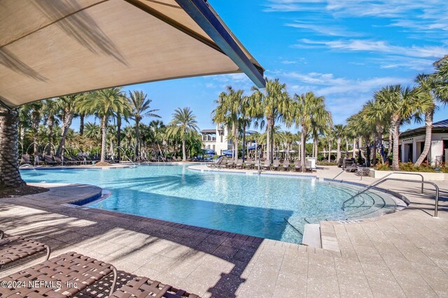 view of swimming pool with a patio area