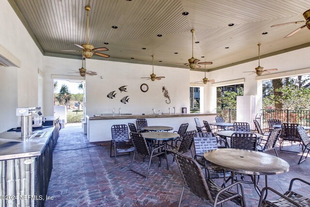 view of patio featuring ceiling fan