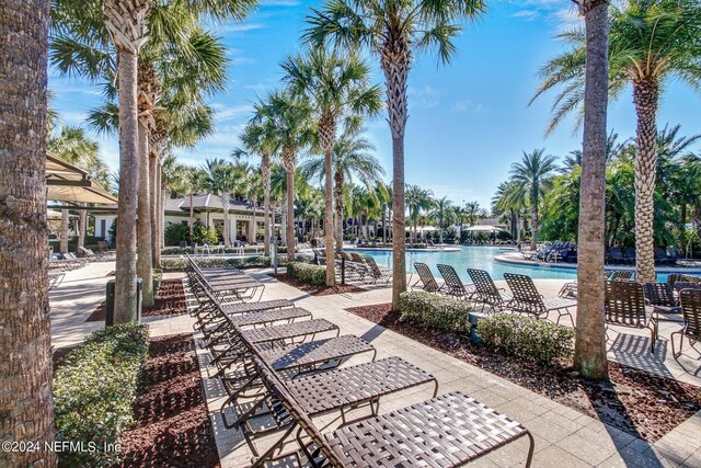 view of swimming pool with a patio area