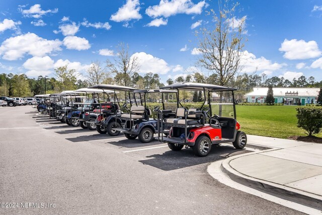 view of parking / parking lot with a yard