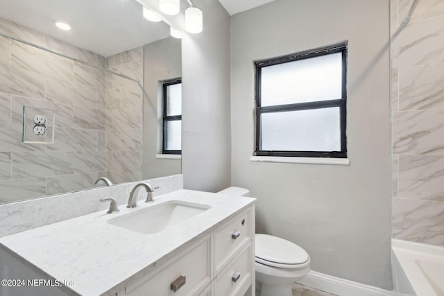 full bath with baseboards, vanity, recessed lighting, and toilet