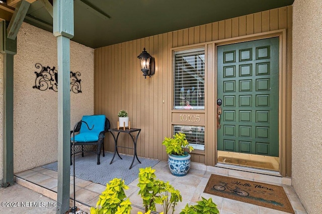 property entrance with covered porch