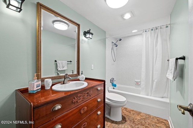 full bathroom with shower / bath combo, vanity, and toilet