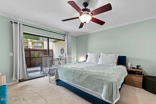 bedroom featuring a textured ceiling, carpet floors, access to outside, and ceiling fan