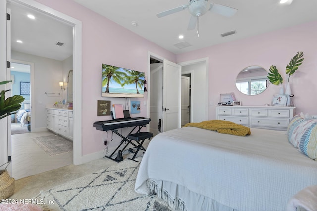 carpeted bedroom with ceiling fan and connected bathroom