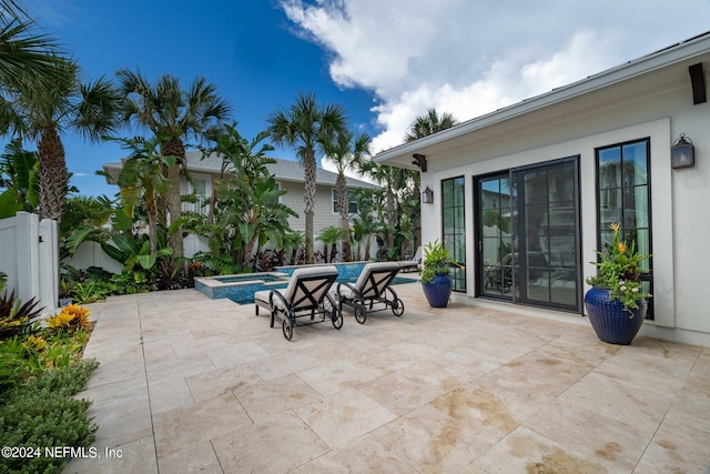 view of patio / terrace with a fenced in pool