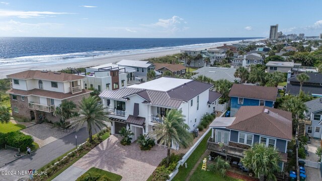 aerial view featuring a water view and a beach view