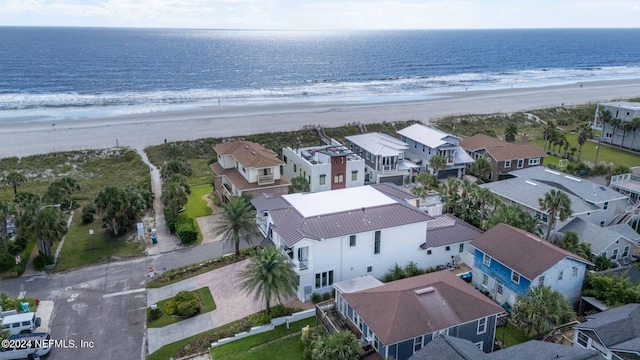 bird's eye view with a view of the beach and a water view