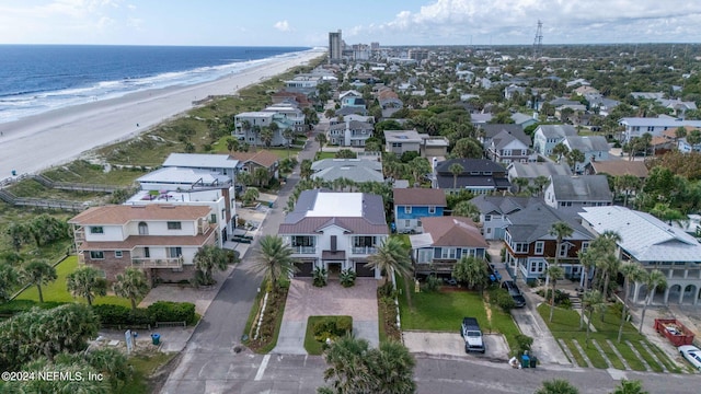 drone / aerial view featuring a view of the beach and a water view